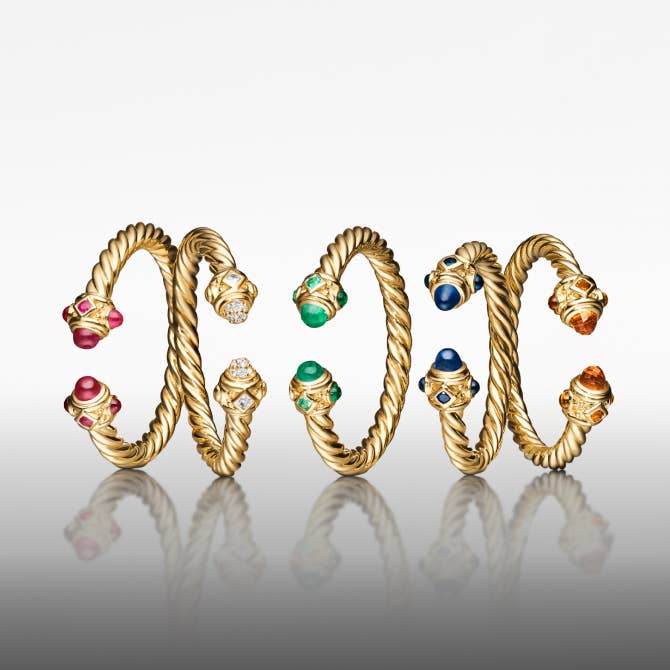 Five David Yurman Renaissance rings in gold.