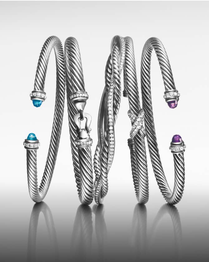 Five David Yurman Cable bracelets in silver.