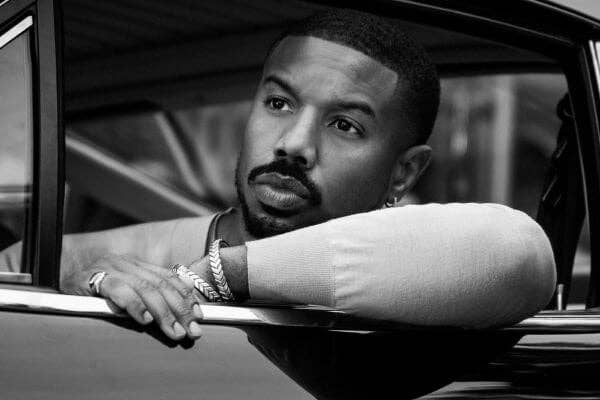 Michael B. Jordan in a car wearing David Yurman Men's Chevron Collection jewelry.