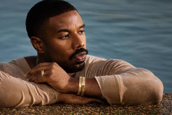 Michael B. Jordan in a pool wearing David Yurman Men's Chevron Collection jewelry.