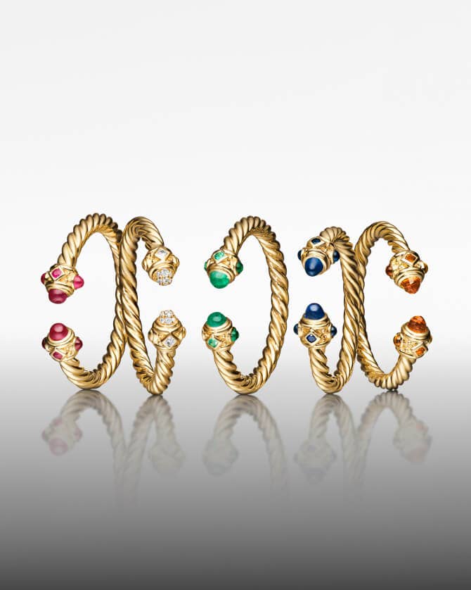 Five David Yurman Renaissance rings in gold.