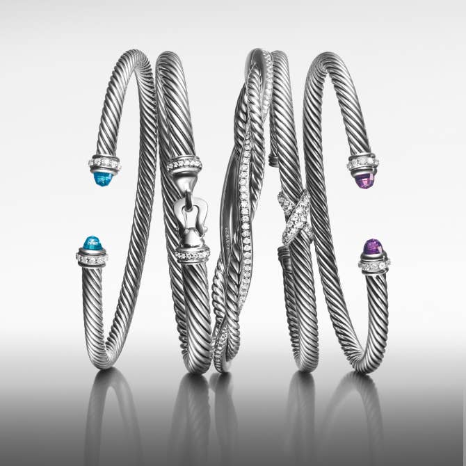 Five David Yurman Cable bracelets in silver.
