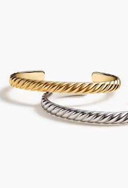 Two David Yurman Sculpted Cable cuff bracelets.