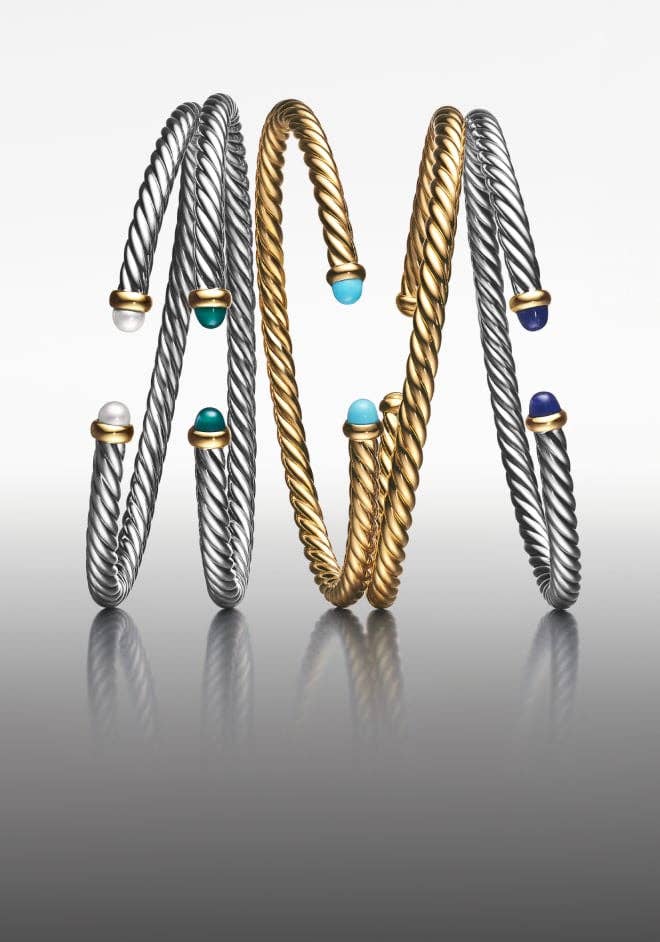 Five David Yurman Cable Flex bracelets in silver and gold.