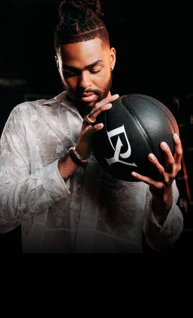 D'Angelo Russell holding a David Yurman basketball.