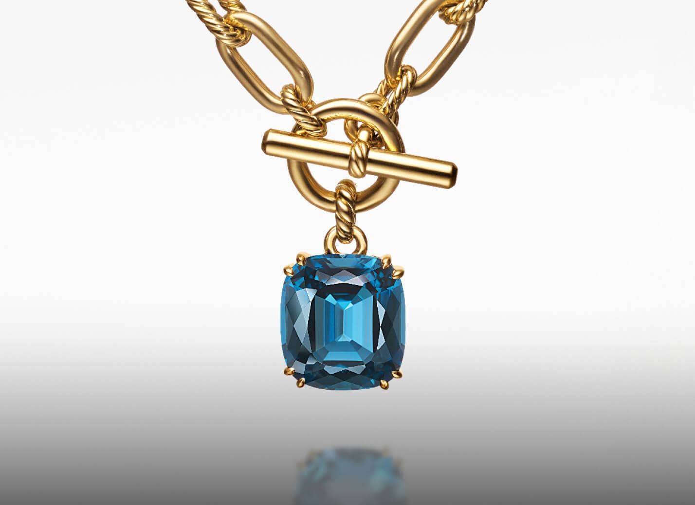 David Yurman's Marbella pendant in yellow gold with hampton blue topaz.