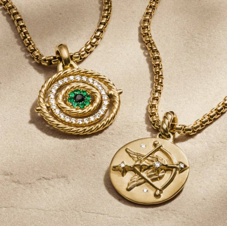 Two gold David Yurman amulets.