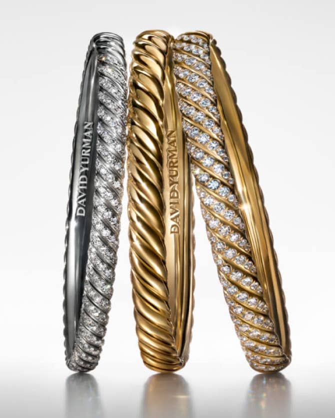 Three David Yurman Sculpted Cable cuff bracelets.