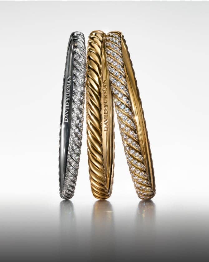 Trois bracelets David Yurman Sculpted Cable.