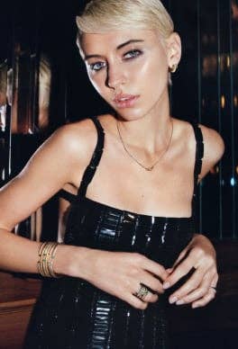 Iris Law wearing David Yurman Cable Flex bracelets.